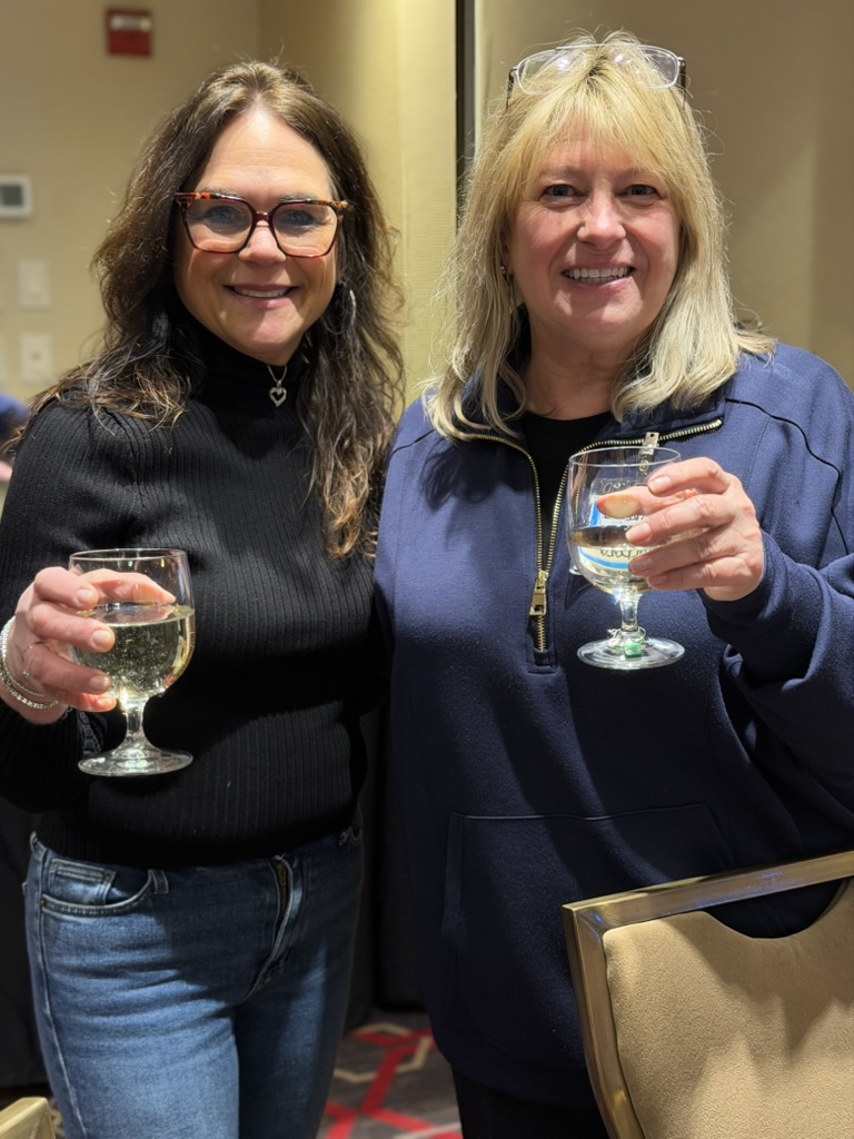 Guests enjoying wine together at a Mah Jongg Mania event
